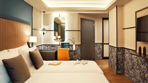 A hotel room with a large bed, a desk, a chair, a mirror, and a TV. - Zeus Essence Athens Central, Trademark Collection by Wyndham (Athens)