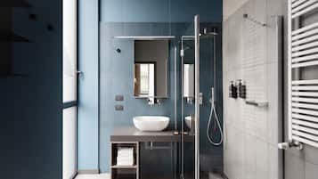 A modern bathroom with a glass shower enclosure, a large white sink, and a towel rack.
