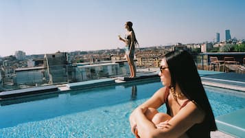 Seasonal outdoor pool, pool loungers