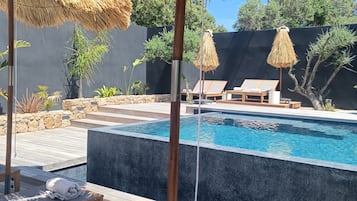 Seasonal outdoor pool, pool umbrellas, pool loungers