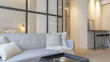 Deluxe Suite (3) | Living area | 50-inch LED TV with cable channels, TV