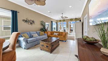 Signature House, 3 Bedrooms, Balcony, Lagoon View | Living room | 55-inch Smart TV with cable channels, TV