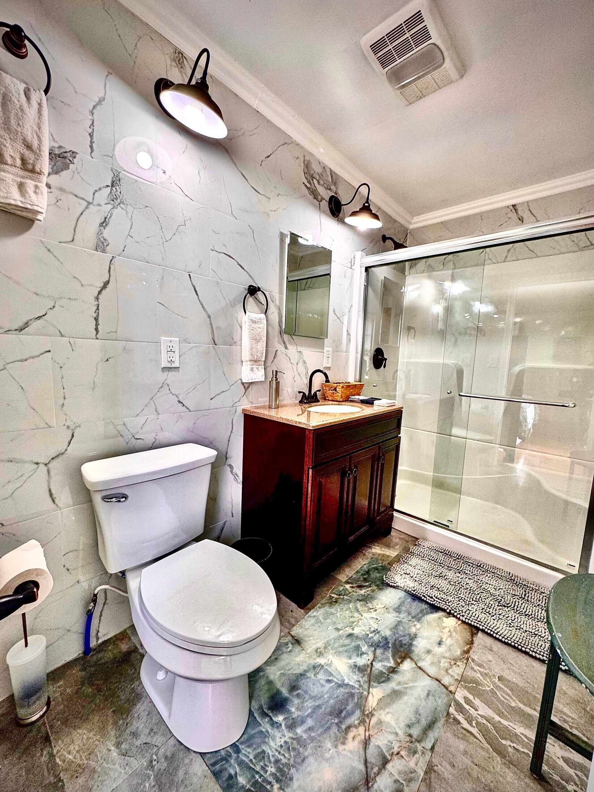 Shower, hair dryer, towels, soap