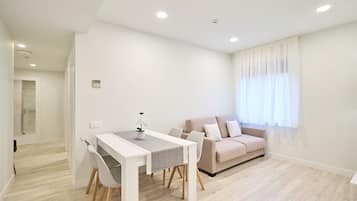 Superior Suite, 2 Bedrooms, Non Smoking | Living area | 32-inch TV with cable channels