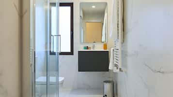 Shower, rainfall showerhead, hair dryer, towels