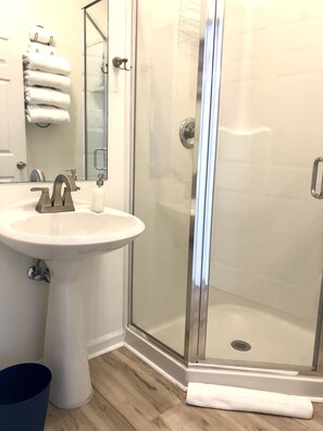 Shower, hair dryer, towels, soap