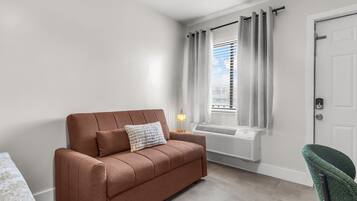 Standard Full Bed Studio with Kitchen & Sofa | Living area