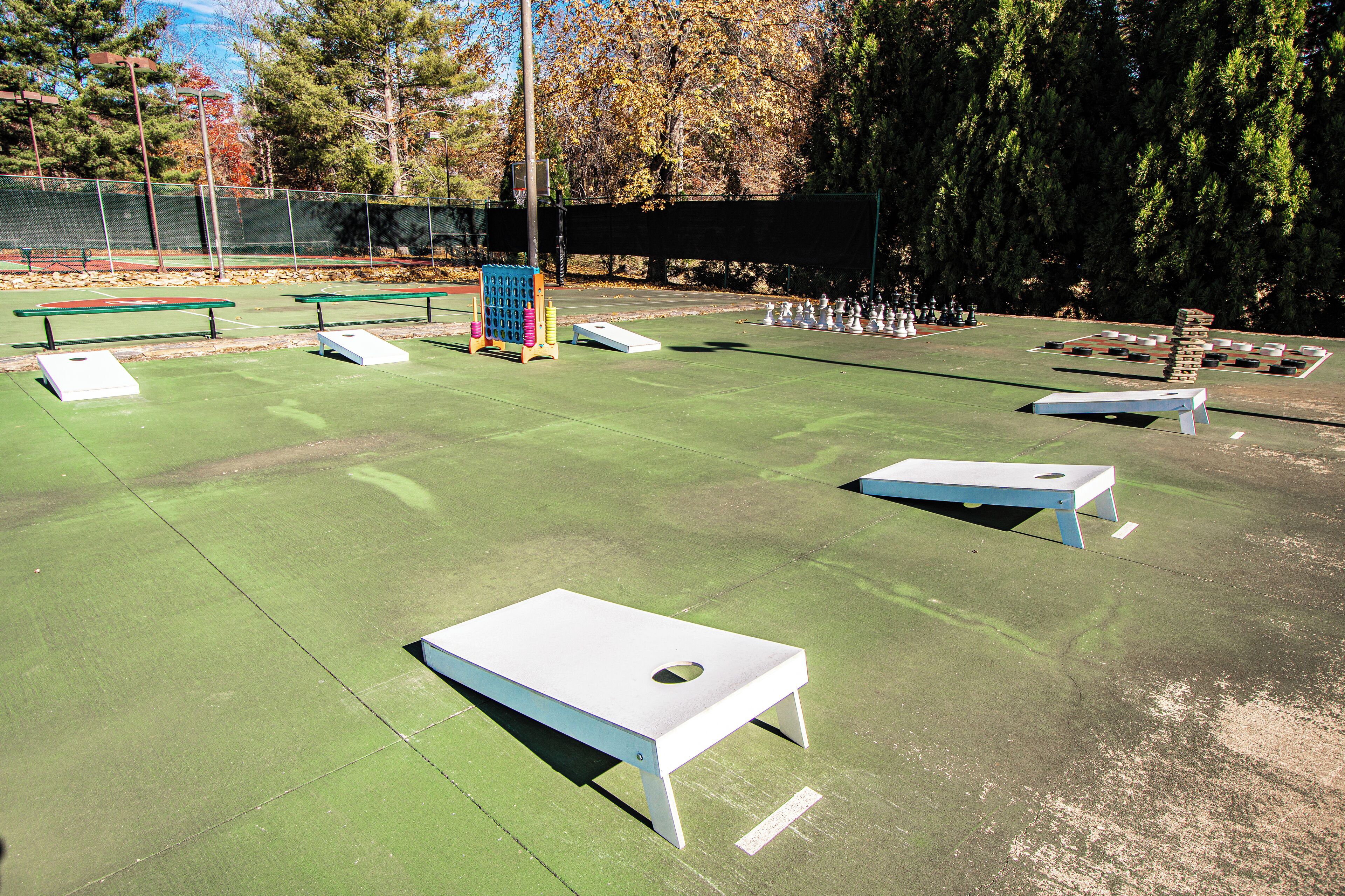 A sports court with multiple tables and a small play area.