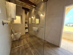 Villa | Bathroom | Shower, deep-soaking bathtub, hair dryer, towels