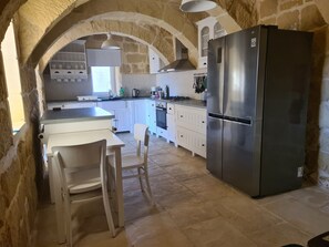 Villa | Private kitchen | Fridge, microwave, oven, stovetop