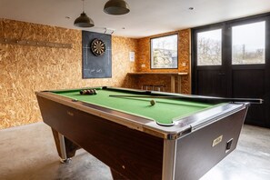 A pool table with balls, a dartboard, and a chalkboard with a drawing. - Ty Rhos Newydd: Stunning pet-friendly, family retreat on Anglesey (Llanerch-y-medd)
