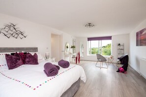 Upstairs king-sized bedroom with Juliette balcony, dressing table and stunning sea views, four-bedroom holiday home near Benllech Beach, Anglesey - Sandaig: Pet-Friendly Holiday Home Near Benllech Beach (Benllech)