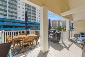 Guests can enjoy al fresco dining on the deck, which features a table and chairs.