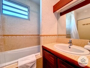 Bathtub, hair dryer, towels, soap