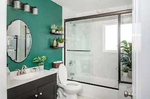 Shower, hair dryer, towels, soap