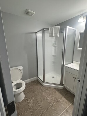 Shower, hair dryer, towels, soap