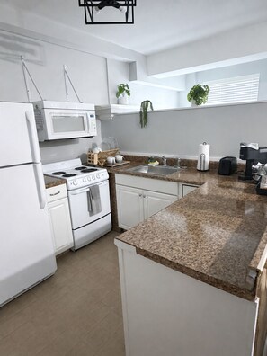 Coffee/tea maker, fridge, microwave, oven