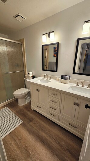 Combined shower/tub, hair dryer, towels, toilet paper