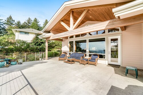 Dog-friendly ocean-view home near the beach with large deck, grill, & Ping-Pong