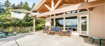 Dog-friendly ocean-view home near the beach with large deck, grill, & Ping-Pong