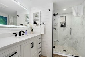 Bathtub, hair dryer, towels, soap