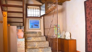 A staircase with stone steps, a wooden handrail, and a metal gate. - Laura's House (Castelcucco)