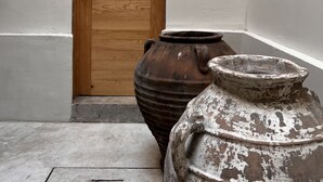 A wooden door with a light switch and a wall-mounted light fixture. - Hotel Atia (Guadalajara)