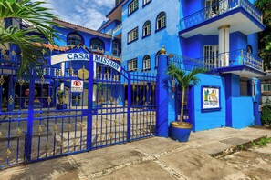 A blue building with a sign reading "CASA MISSION" and a gated entrance. - OYO Casa Mission (Puerto Vallarta)