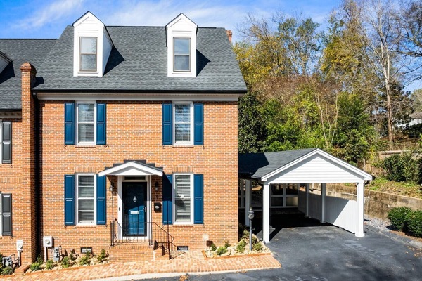 End unit with your own carport and sunroom!