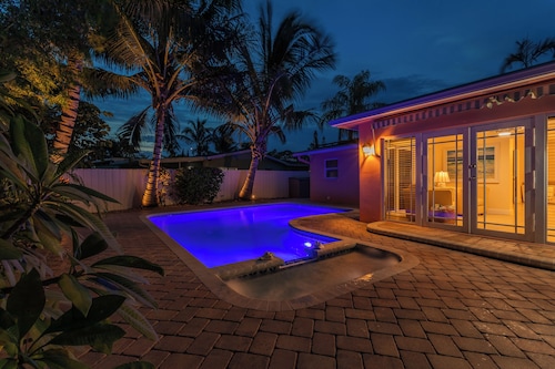 Coastal retreat with heated saltwater pool & spa in prime Delray Beach.