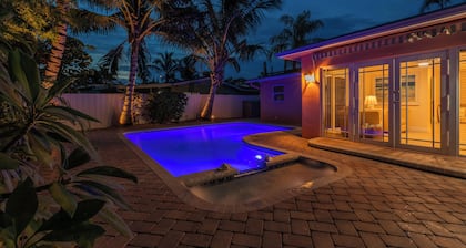 Coastal retreat with heated saltwater pool & spa in prime Delray Beach.