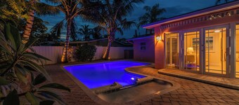 Coastal retreat with heated saltwater pool & spa in prime Delray Beach.