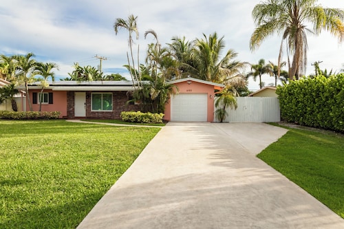 Coastal retreat with heated saltwater pool & spa in prime Delray Beach.