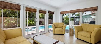 Coastal retreat with heated saltwater pool & spa in prime Delray Beach.