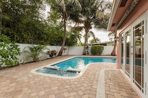 Outdoor pool, a heated pool - Coastal retreat with heated saltwater pool & spa in prime Delray Beach. (Delray Beach)