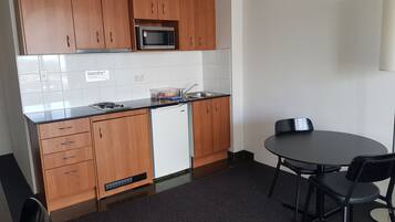 Apartment | Private kitchen | Mini-fridge, dining tables