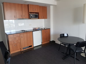 Apartment | Private kitchen | Mini-fridge, dining tables - Parramatta Hotel in Mantra Building (Parramatta)