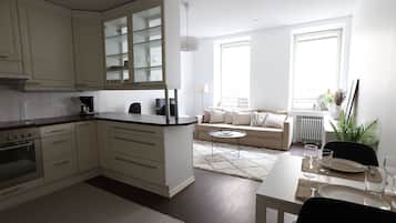 City Apartment | Living area | 36-inch TV with cable channels