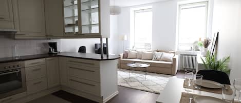 City Apartment | Living area | 36-inch TV with cable channels