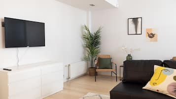 Premium Apartment | Living area | 36-inch flat-screen TV with cable channels, TV