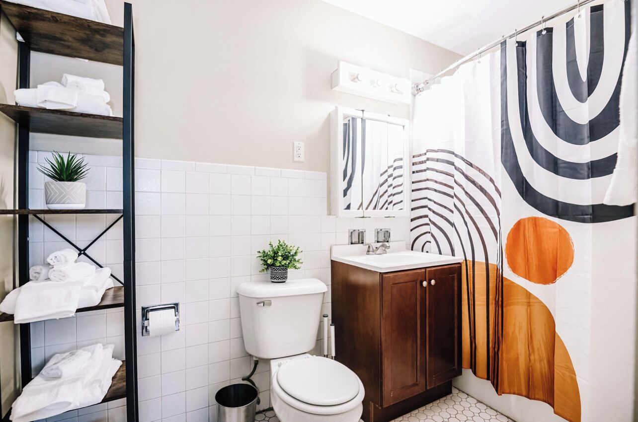 Bathtub, hair dryer, towels, soap