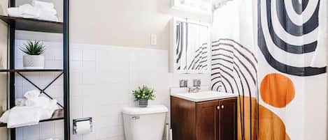 Bathtub, hair dryer, towels, soap