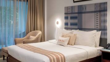 Desk, laptop workspace, bed sheets