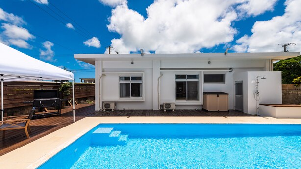 A modern house with a swimming pool, a barbecue area, and a covered patio. - MARINUS (Miyakojima)