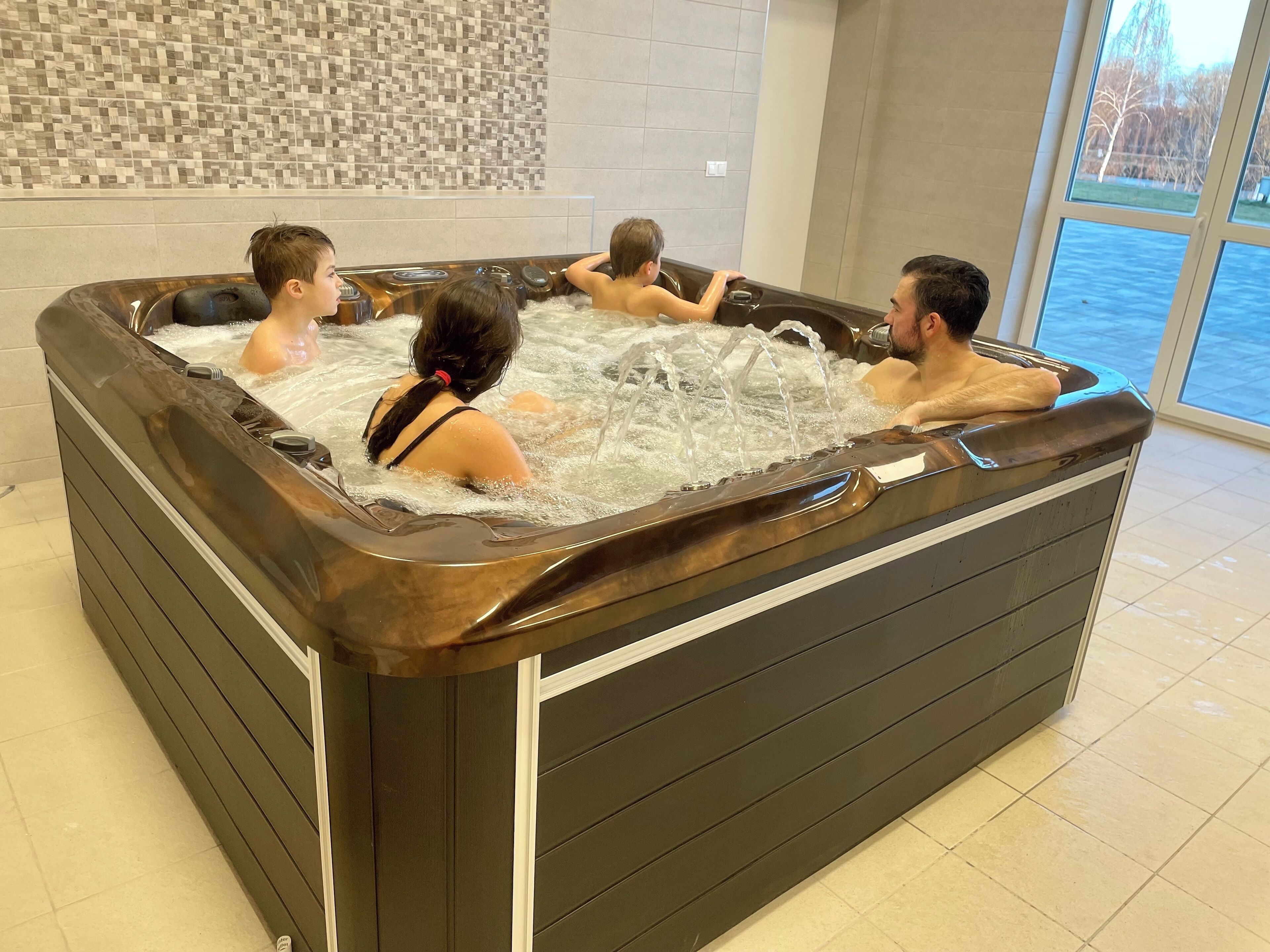 A hot tub with four people.