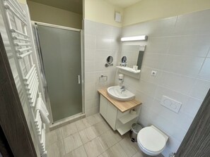 Shower, free toiletries, hair dryer, slippers