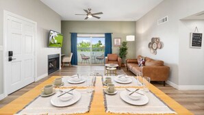 A modern living room with a dining area set up for a meal. - Old Town Condo Paradise | Pool | Hot tub | Location (Scottsdale)