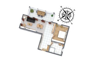 Een 2D plattegrond van een hotelkamer met een zithoek, een eetgedeelte en een slaapkamer.