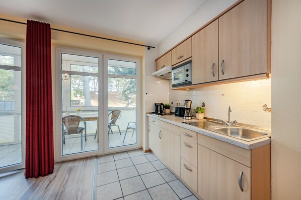Fridge, microwave, stovetop, coffee/tea maker