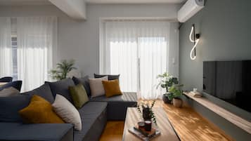 Luxury Apartment, 4 Bedrooms, Balcony | Living area | 42-inch Smart TV with digital channels, TV